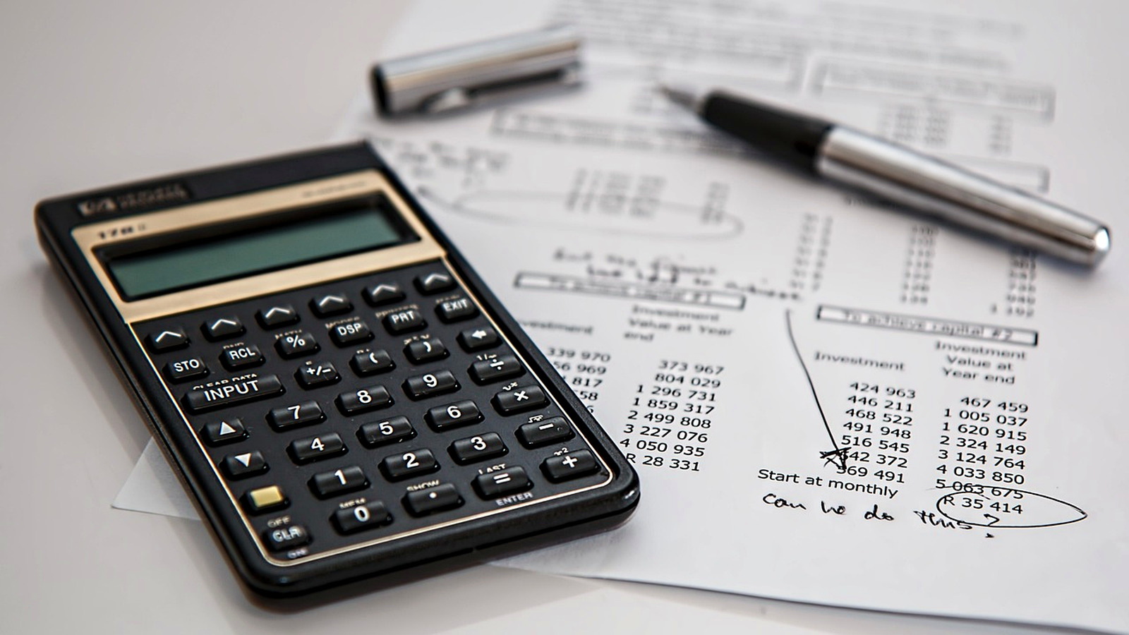 Homeowner comparing multiple contractor quotes